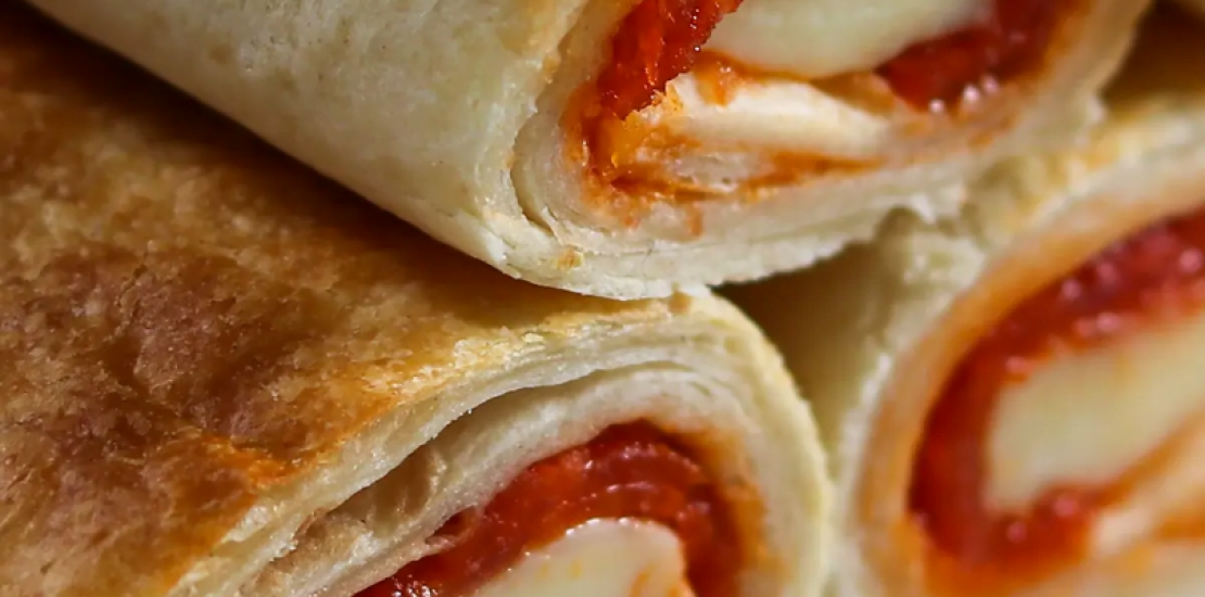 Hot, fresh, and right out of the air fryer - Easy Air Fryer Pizza Rolls are the perfect meal or snack!