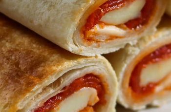 Hot, fresh, and right out of the air fryer - Easy Air Fryer Pizza Rolls are the perfect meal or snack!